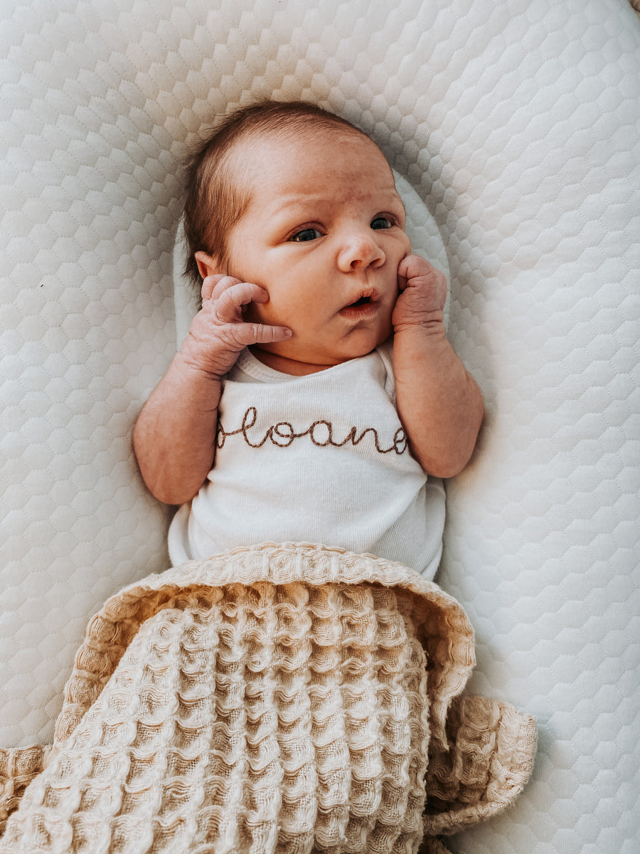 Jersey onesie with embroidered lettering