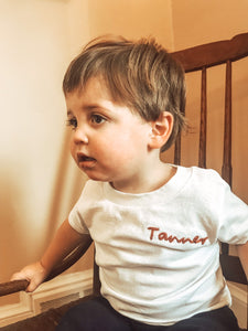 boy wearing hand embroidered cotton toddler name t-shirt 